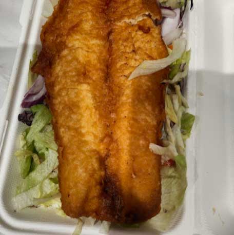 fish and chips with salad served at Aldo’s Fish Bar in Broxburn